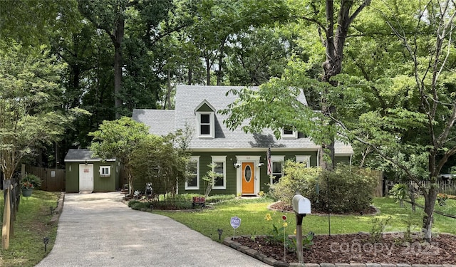 7639 Winterset Dr, Charlotte, NC 28270 - cape cod home with concrete driveway, a front yard, and roof with shingles