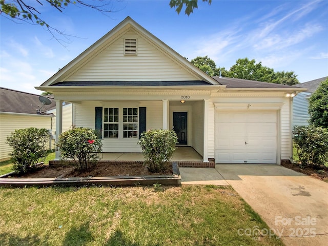 2010 Kansas City Dr, Monroe, NC 28110 - view of front of house featuring covered porch, a garage, and driveway