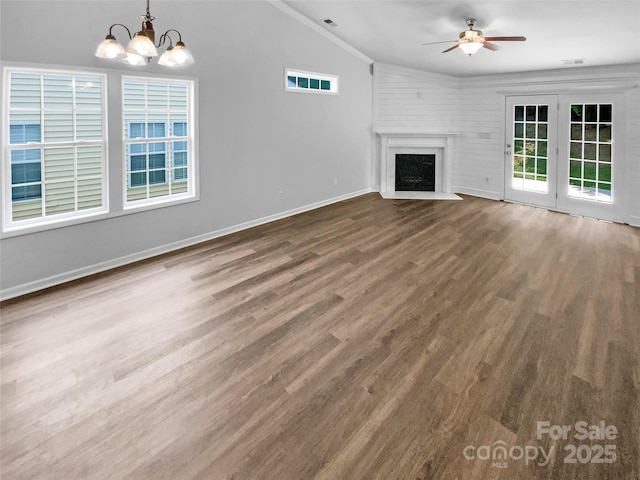 2010 Kansas City Dr, Monroe, NC 28110 - unfurnished living room with lofted ceiling, ceiling fan, a chandelier, wood finished floors, and crown molding