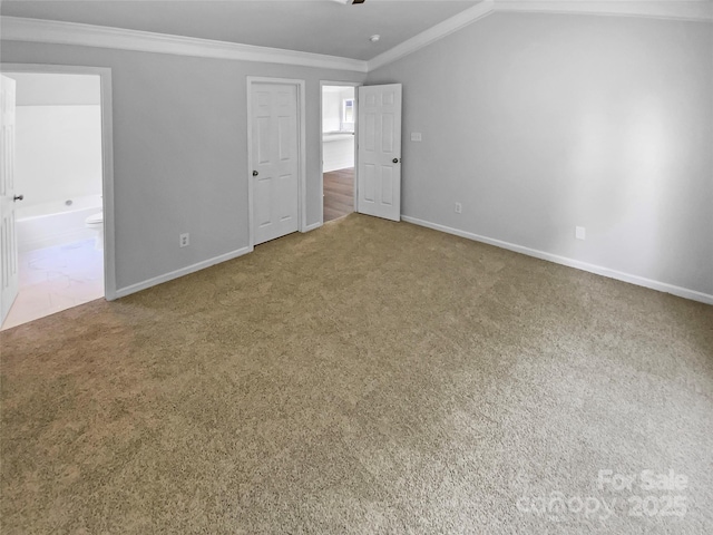 2010 Kansas City Dr, Monroe, NC 28110 - unfurnished bedroom with ornamental molding, carpet flooring, connected bathroom, and vaulted ceiling