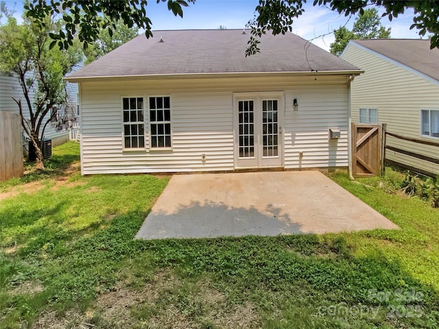 2010 Kansas City Dr, Monroe, NC 28110 - rear view of property with a patio area and roof with shingles