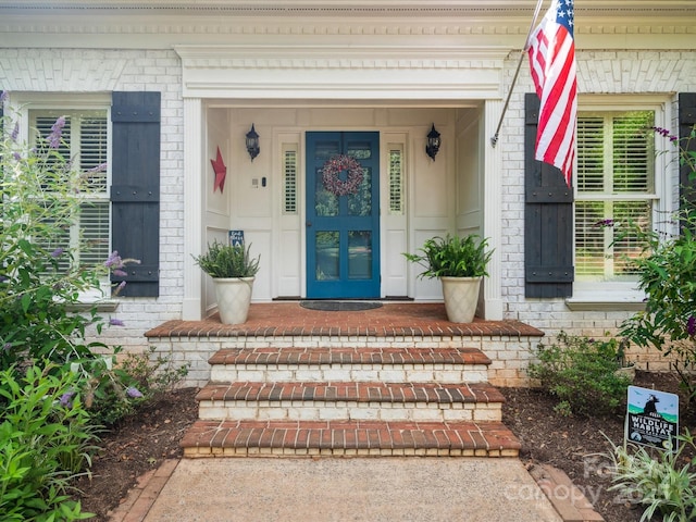 2032 Greenbrook Pkwy, Matthews, NC 28104 - entrance to property with a porch and brick siding