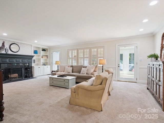 2032 Greenbrook Pkwy, Matthews, NC 28104 - living area with light carpet, ornamental molding, recessed lighting, a fireplace, and built in shelves