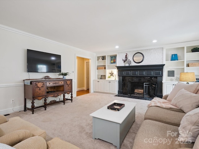 2032 Greenbrook Pkwy, Matthews, NC 28104 - living room featuring built in features, ornamental molding, a large fireplace, recessed lighting, and light colored carpet