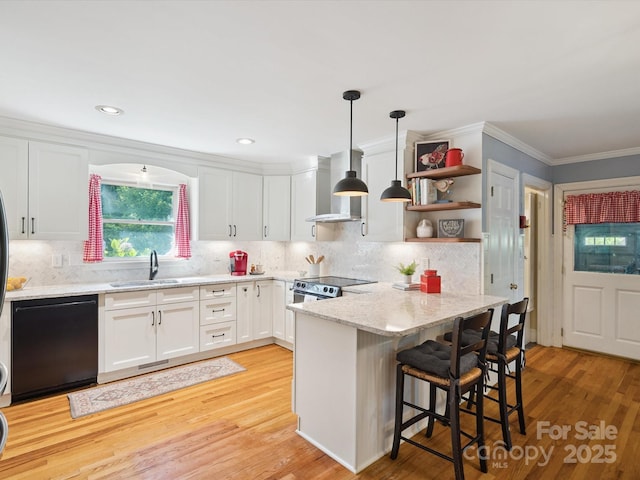 2032 Greenbrook Pkwy, Matthews, NC 28104 - kitchen featuring black dishwasher, wall chimney range hood, a peninsula, white cabinets, and ornamental molding