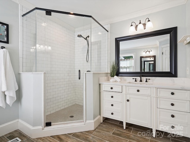 2032 Greenbrook Pkwy, Matthews, NC 28104 - full bath with a shower stall, vanity, wood finish floors, and crown molding