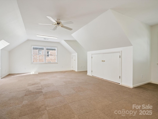 2032 Greenbrook Pkwy, Matthews, NC 28104 - additional living space featuring a ceiling fan, vaulted ceiling, and light colored carpet