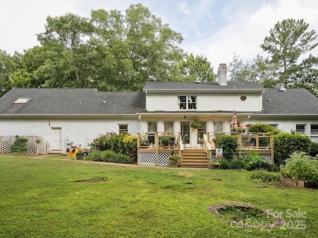 2032 Greenbrook Pkwy, Matthews, NC 28104 - rear view of property with a chimney, a yard, brick siding, a deck, and a shingled roof