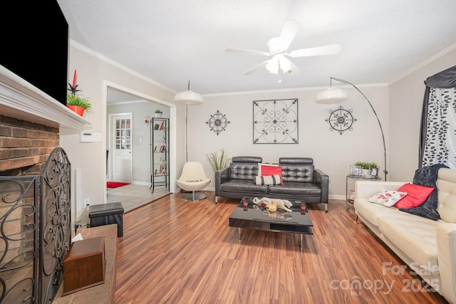 713 Hickory Hill Ct, Gastonia, NC 28054 - living area with ceiling fan, wood finished floors, crown molding, and a fireplace