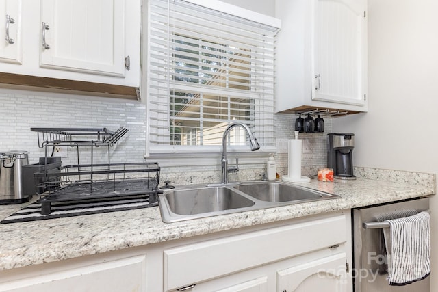 713 Hickory Hill Ct, Gastonia, NC 28054 - kitchen featuring backsplash, white cabinetry, and stainless steel dishwasher