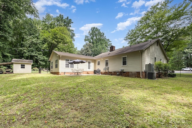 713 Hickory Hill Ct, Gastonia, NC 28054 - rear view of property featuring crawl space, a chimney, and a storage shed