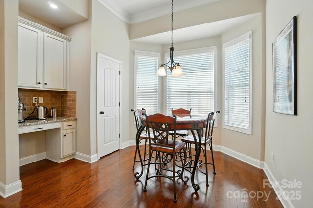 9330 Carneros Creek Rd, Charlotte, NC 28214 - dining space with dark wood finished floors and crown molding