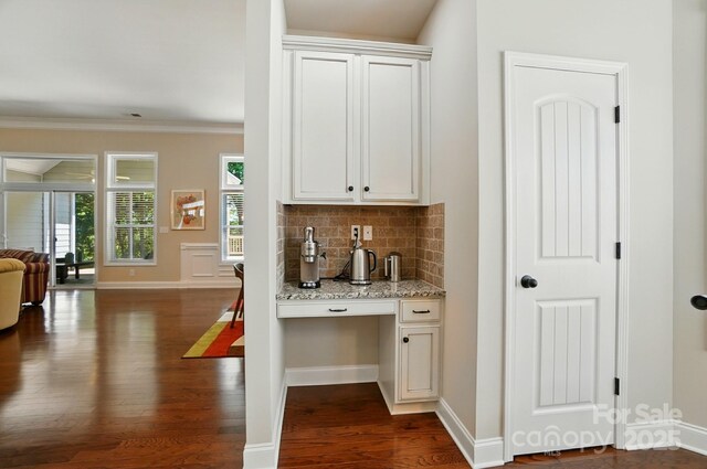 9330 Carneros Creek Rd, Charlotte, NC 28214 - bar featuring dark wood-type flooring, decorative backsplash, and crown molding