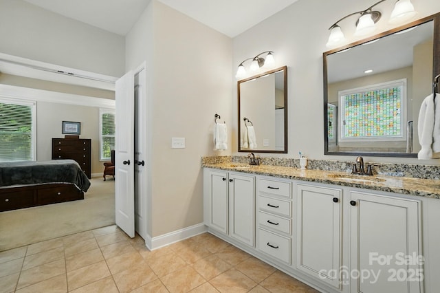9330 Carneros Creek Rd, Charlotte, NC 28214 - full bath with double vanity, plenty of natural light, tile patterned flooring, and connected bathroom