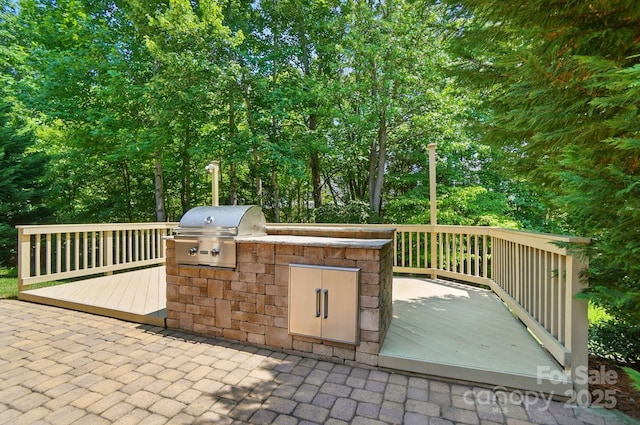 9330 Carneros Creek Rd, Charlotte, NC 28214 - view of patio featuring a wooden deck and exterior kitchen