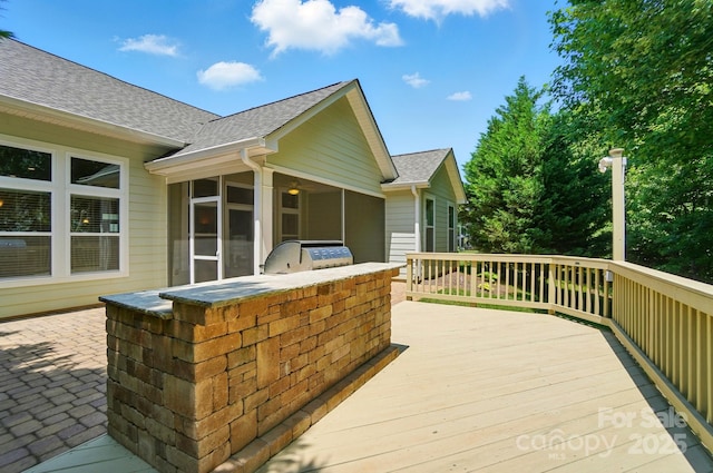 9330 Carneros Creek Rd, Charlotte, NC 28214 - wooden deck with an outdoor kitchen and a sunroom