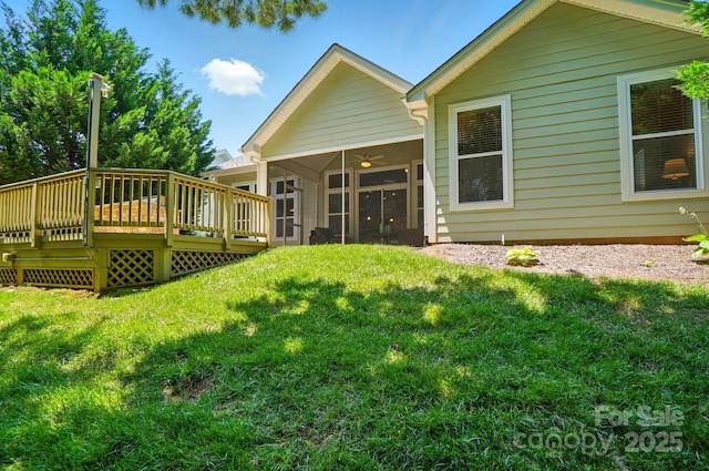 9330 Carneros Creek Rd, Charlotte, NC 28214 - rear view of property featuring a sunroom, a lawn, a wooden deck, and a ceiling fan