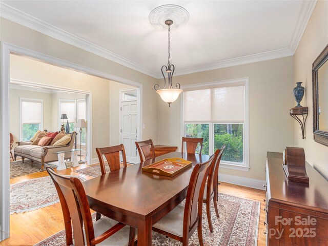 1 Hickory Rdg, Fletcher, NC 28732 - dining area featuring light wood-style floors, healthy amount of natural light, and ornamental molding