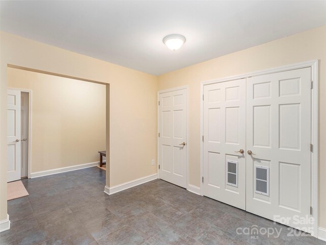 1 Hickory Rdg, Fletcher, NC 28732 - unfurnished bedroom with baseboards and a closet