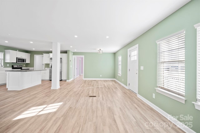 3433 Spinner Ct, Sherrills Ford, NC 28673 - unfurnished living room featuring light wood finished floors and recessed lighting