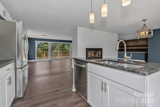 41 Remembrance Rdg, Flat Rock, NC 28731 - kitchen with open floor plan, appliances with stainless steel finishes, dark wood-style floors, and white cabinetry