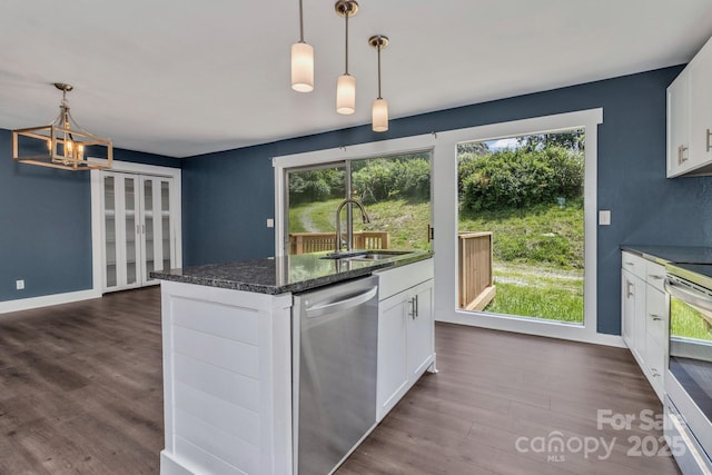 41 Remembrance Rdg, Flat Rock, NC 28731 - kitchen with appliances with stainless steel finishes, a chandelier, dark wood-style floors, white cabinetry, and dark stone countertops