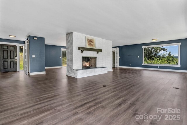 41 Remembrance Rdg, Flat Rock, NC 28731 - unfurnished living room featuring dark wood-type flooring and a fireplace
