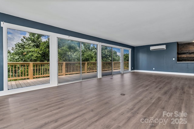 41 Remembrance Rdg, Flat Rock, NC 28731 - unfurnished living room with wood finished floors and a wall unit AC