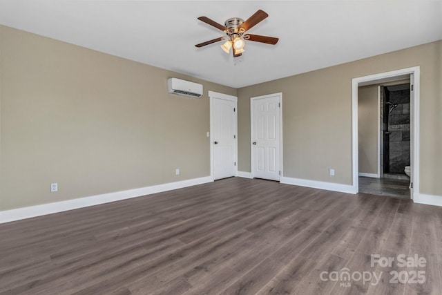 41 Remembrance Rdg, Flat Rock, NC 28731 - unfurnished bedroom featuring a wall unit AC, dark wood-style flooring, ensuite bath, and ceiling fan