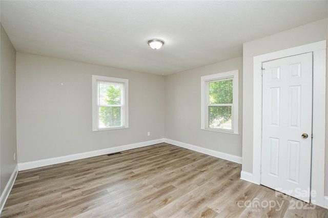 636 Forest St NW, Concord, NC 28025 - empty room with light wood-type flooring and baseboards