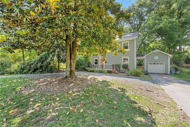 2034 Lanier Ave, Charlotte, NC 28205 - obstructed view of property featuring a garage, driveway, and a front yard