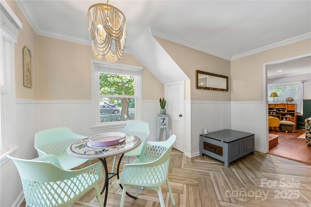 2034 Lanier Ave, Charlotte, NC 28205 - dining space with wainscoting, a chandelier, and crown molding
