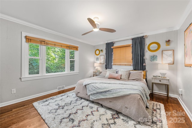 2034 Lanier Ave, Charlotte, NC 28205 - bedroom featuring ornamental molding, wood finished floors, and a ceiling fan