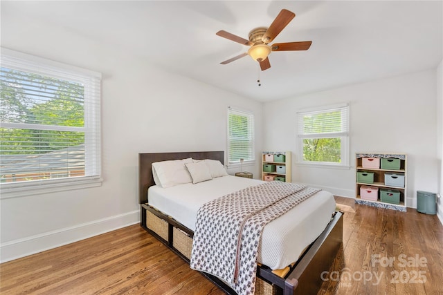 2034 Lanier Ave, Charlotte, NC 28205 - bedroom with wood finished floors and a ceiling fan