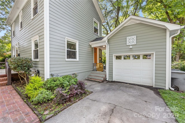 2034 Lanier Ave, Charlotte, NC 28205 - view of front of property featuring asphalt driveway and a garage