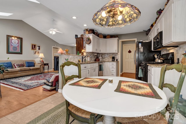 16 Sunview Cir, Arden, NC 28704 - dining room with a ceiling fan, a skylight, light tile patterned floors, vaulted ceiling, and recessed lighting