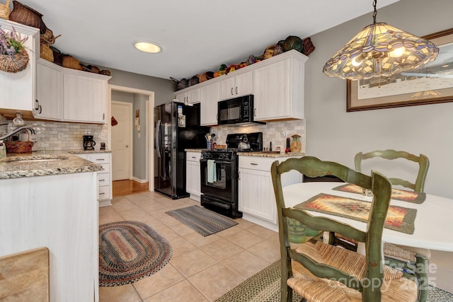 16 Sunview Cir, Arden, NC 28704 - kitchen featuring black appliances, decorative backsplash, and white cabinetry