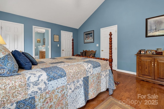 16 Sunview Cir, Arden, NC 28704 - bedroom with wood finished floors, high vaulted ceiling, and connected bathroom