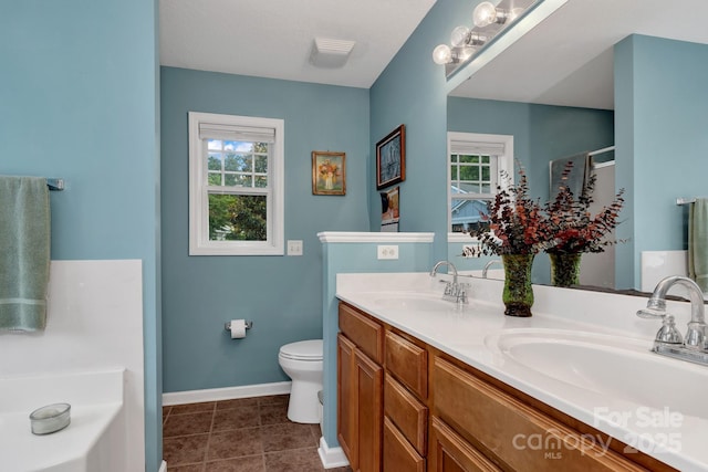 16 Sunview Cir, Arden, NC 28704 - bathroom with double vanity, tile patterned flooring, and a tub