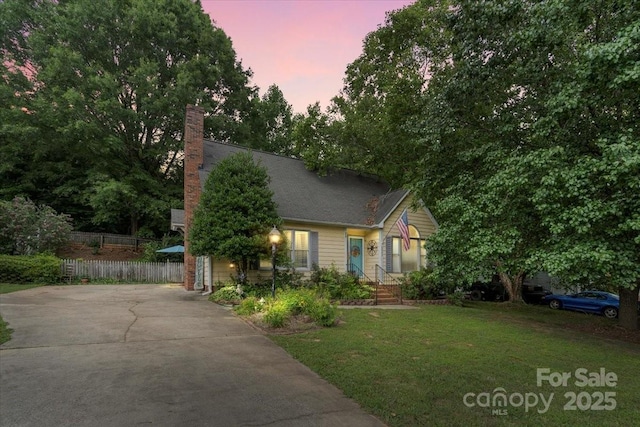 111 Beacon Hills Dr, Gastonia, NC 28056 - obstructed view of property with a chimney and driveway