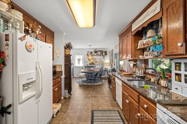 111 Beacon Hills Dr, Gastonia, NC 28056 - kitchen featuring white appliances, brown cabinets, open shelves, dark stone counters, and dark tile patterned floors