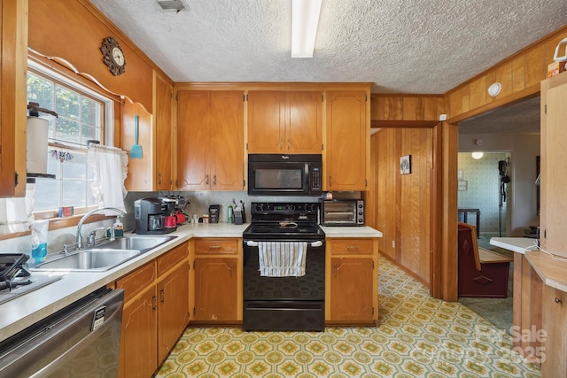 203 Shuping St, Morganton, NC 28655 - kitchen with black appliances, light countertops, a textured ceiling, and brown cabinetry