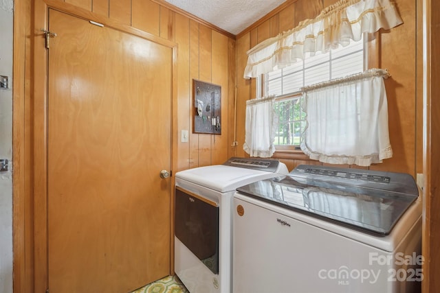 203 Shuping St, Morganton, NC 28655 - laundry area featuring washer and clothes dryer, ornamental molding, and wooden walls