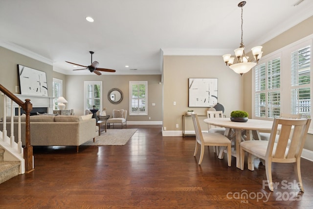 12525 Druids Glen Dr, Pineville, NC 28134 - dining room with ornamental molding, a chandelier, dark wood-type flooring, recessed lighting, and stairs