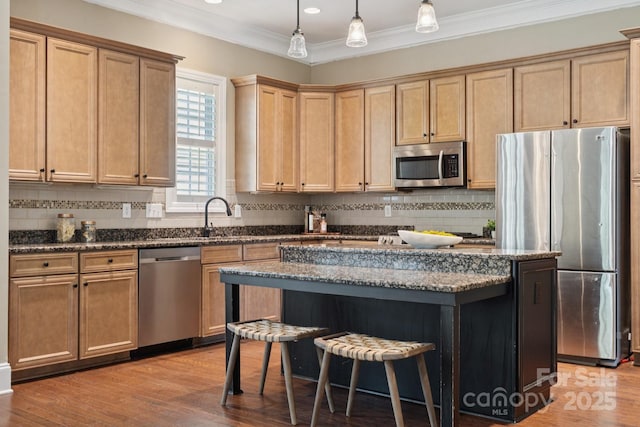 12525 Druids Glen Dr, Pineville, NC 28134 - kitchen featuring stainless steel appliances, a breakfast bar area, decorative backsplash, a center island, and light wood-style floors