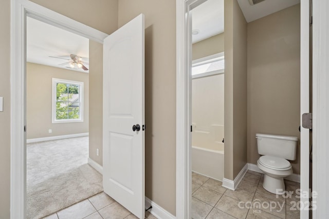 12525 Druids Glen Dr, Pineville, NC 28134 - bathroom with tile patterned flooring, ceiling fan, and a tub to relax in