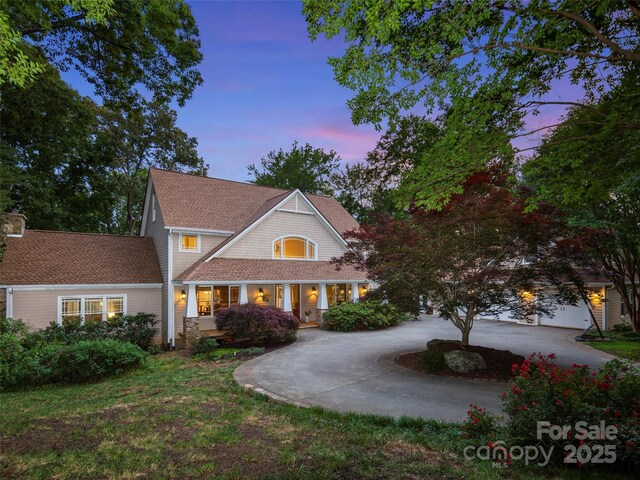 303 S Braeside Ct, Asheville, NC 28803 - shingle-style home with curved driveway and a shingled roof