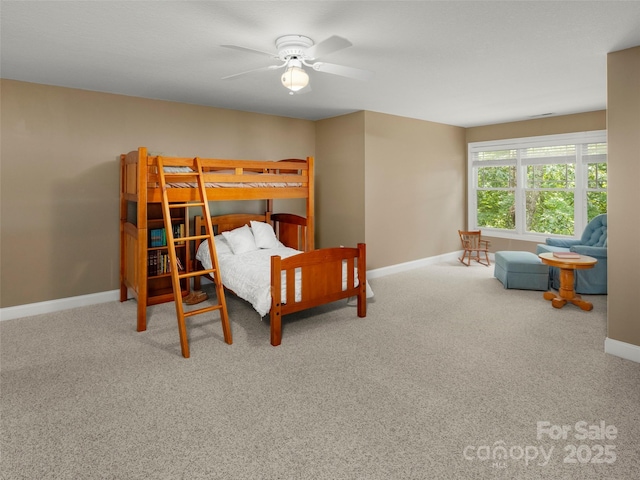 303 S Braeside Ct, Asheville, NC 28803 - carpeted bedroom featuring baseboards and a ceiling fan