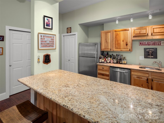 303 S Braeside Ct, Asheville, NC 28803 - kitchen featuring stainless steel appliances, dark wood-style floors, light stone countertops, and a kitchen breakfast bar