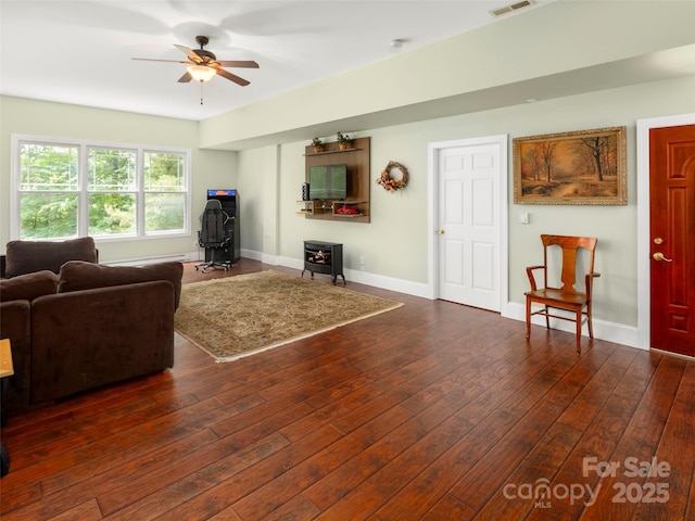 303 S Braeside Ct, Asheville, NC 28803 - living room with a wood stove, ceiling fan, and hardwood / wood-style flooring